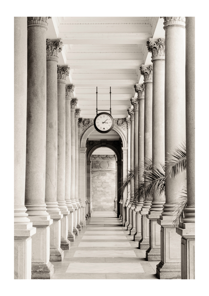 pillars and palm leaves and a clock. 