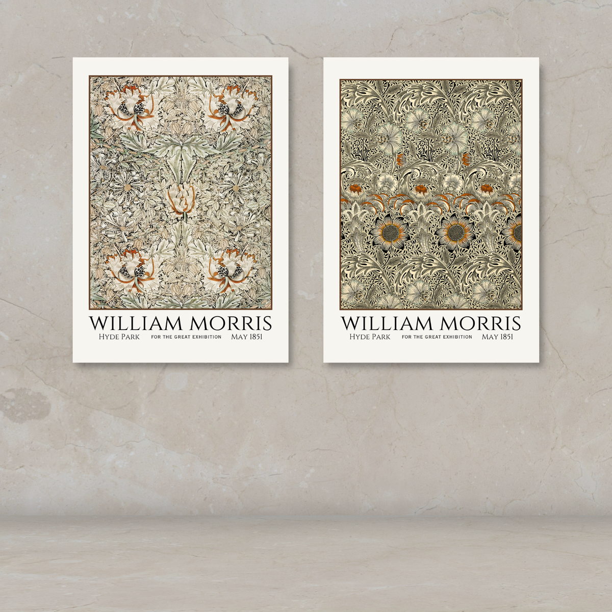 Two William Morris art posters displayed side by side on a textured beige wall above a light stone surface. The left poster shows a floral pattern with the text 'WILLIAM MORRIS' and 'HYDE PARK' below, and the right poster shows a matching floral pattern with 'WILLIAM MORRIS' and 'MAY (8th)' below.
